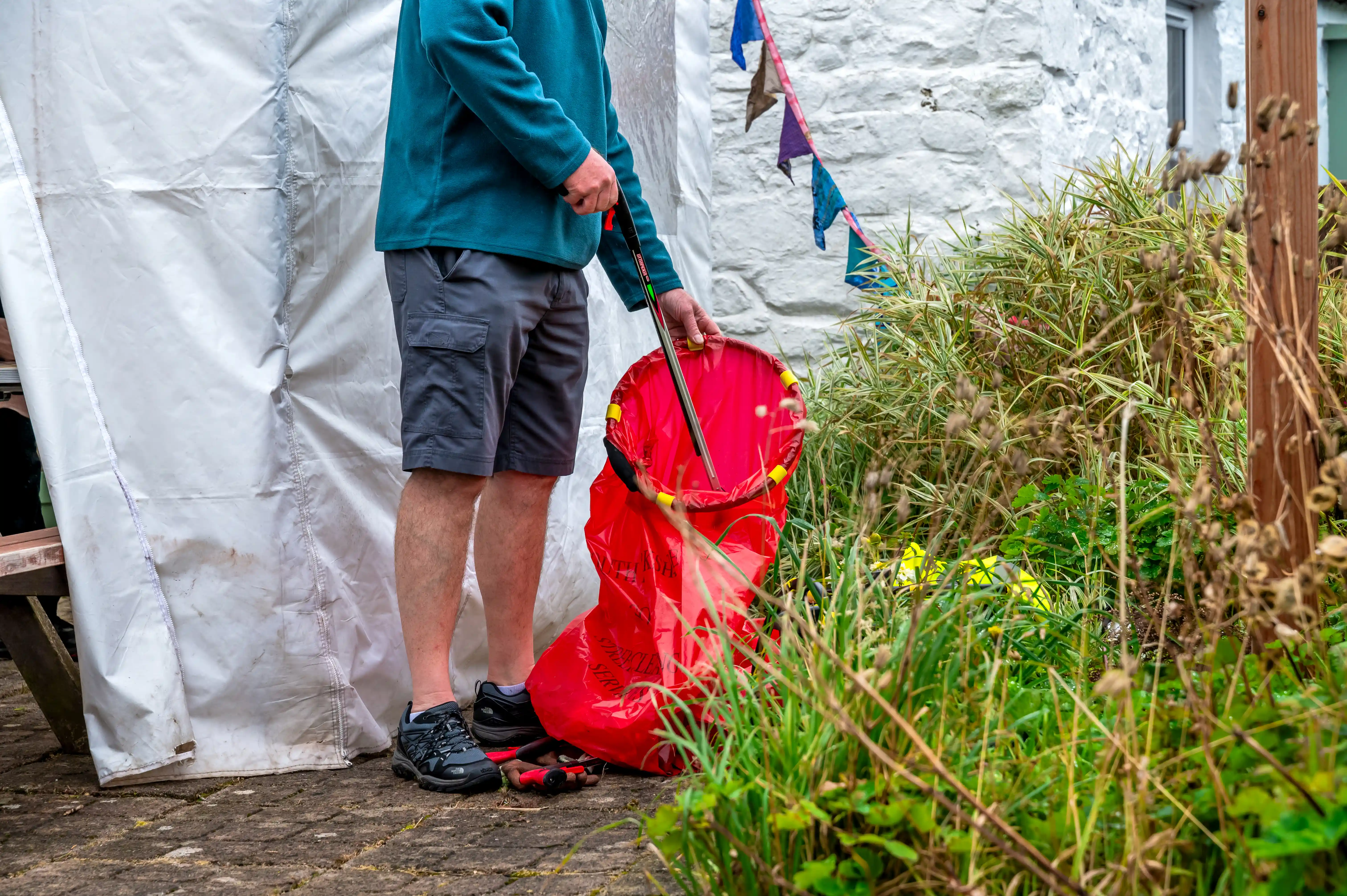 Man picking up litter at Lanarkshire Climate Action Festival 2024 - Photography by Lucy Knott