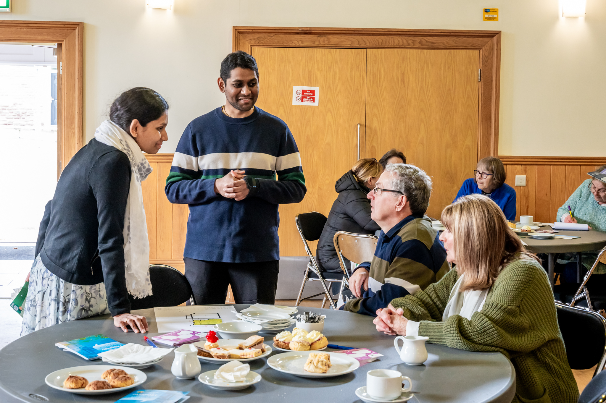 Four people chatting at a table at Lanarkshire Climate Action Festival
